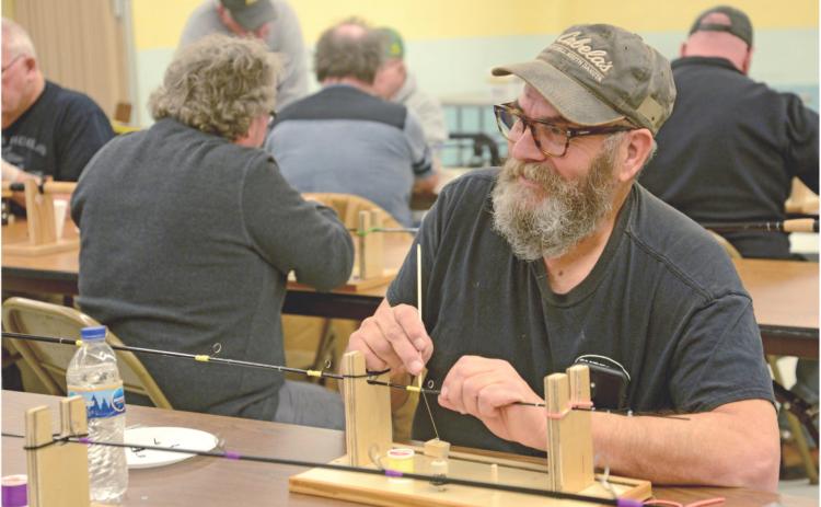 Veterans spend day building fishing poles