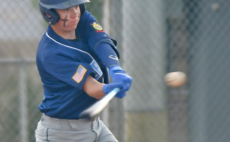 Webster’s Legion Post 40 batter Sheldon Schmieg takes a swing at the ball pitched to him by Winner/Colome June 15. Ultimately Post 40 fell 2-9 on the night. Reporter &amp; Farmer | Amanda Dulitz
