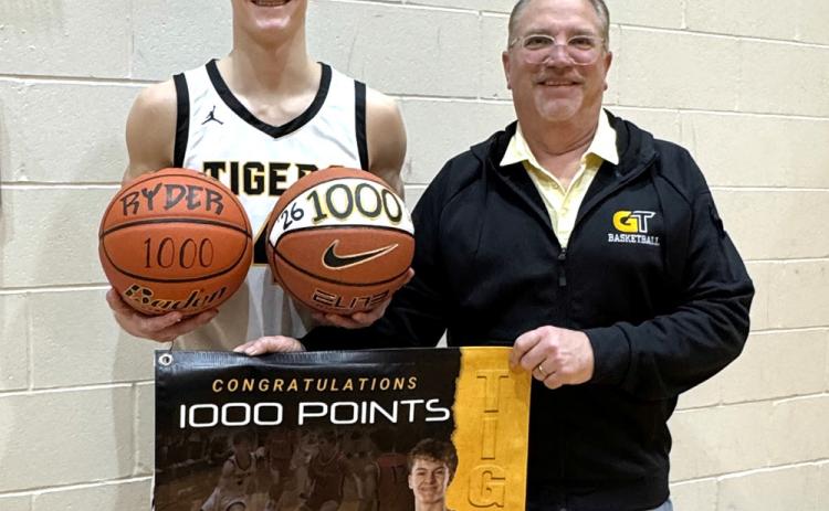 Groton Area senior Ryder Johnson, pictured Jan. 15 with head coach Greg Kjellsen after scoring his 1,000th career varsity point, now has his eyes set on leading the Tigers to a state tournament appearence in his final season. Johnson scored his 1,000th point in an 83-9 victory over Tiospa Zina in a 15 point performance. Reporter &amp; Farmer | Subscriber snapshot