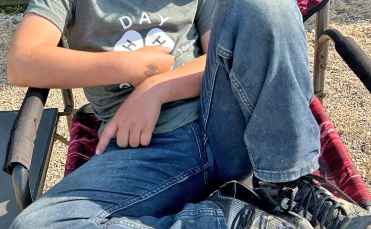 It was a long, tiring weekend, as illustrated by 4-Her Logan Wik who fell asleep during the premium sale at the Day County Fair Aug. 10. He is the son of Shawn and Jessica Wik. Reporter &amp; Farmer | Subscriber snapshot