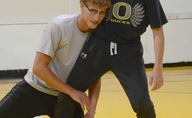 Webster Area 2022 graduate Cael Larson demonstrates a move on incoming Webster Area eighth grader Vance Tollifson. Webster Area Wrestling Booster Club hosted the camp for wrestlers sixth grade and under, Thursday July 24 at the wrestling room. Following the camp a summer party took place at Webster Aquatic Center. Reporter &amp; Farmer | Annie Witt