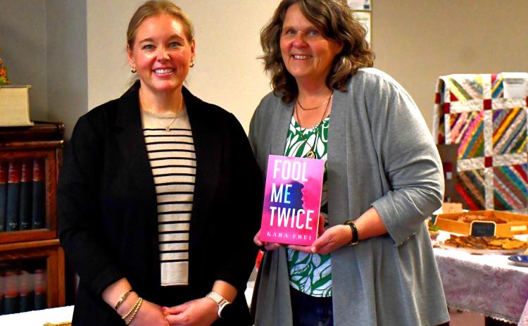 Author visits Webster and falls in love