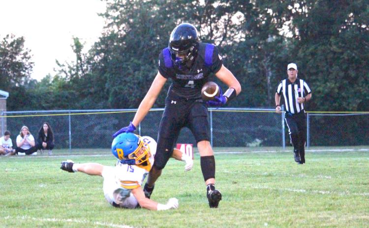 Waubay-Summit tight end Hogan Hlavacek narrowly escapes a Redfield defender Sept. 4. Mustangs defeated the pheasants by a comfortable 50-0 margin, securing its third win of the season and first place in the Eastern Coteau 9-man division. Reporter &amp; Farmer | Timothy Gibson