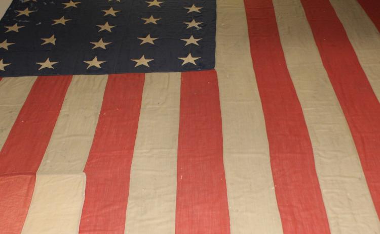 The flag that flew over Fort Sisseton in its final days as a military post lies on display inside the Historic Park’s visitor center. Over 130 years old, the tattered flag was restored by dozens of volunteers, yet these stars and stripes remain imperfect and beloved – like the nation it represents. Reporter &amp; Farmer | Timothy Gibson