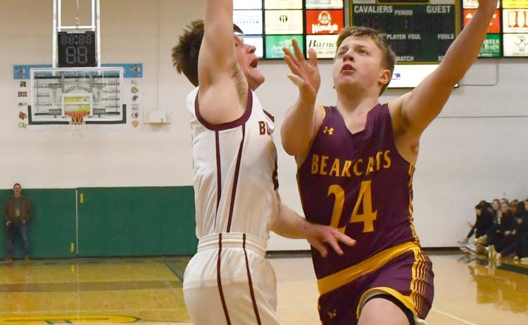 Webster Area boys basketball faced Milbank in Aberdeen March 4 in the first round match of the Region 1A bracket. Bearcats went on to lose the contest 20-54. Here, McKoy Pereboom (24) drives to the basket while Milbank defender Bryan Meyer (4) attempts to block the shot. Reporter &amp; Farmer | Brenner Cariveau
