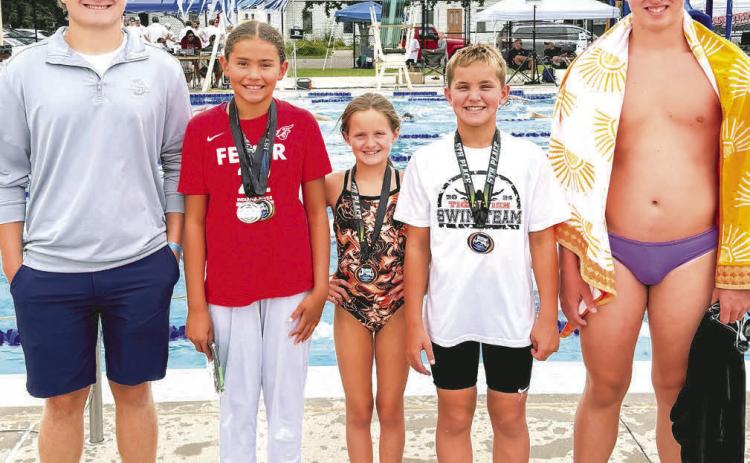 Webster swimmers qualified to swim in the State A swim meet July 18-20. From left are coach Thomas Kuecker, 400 freestyle State A champion Keisha Rencountre, Libby Huggett, Landen Lee and McKoy Pereboom. Reporter &amp; Farmer | Subscriber snaphot