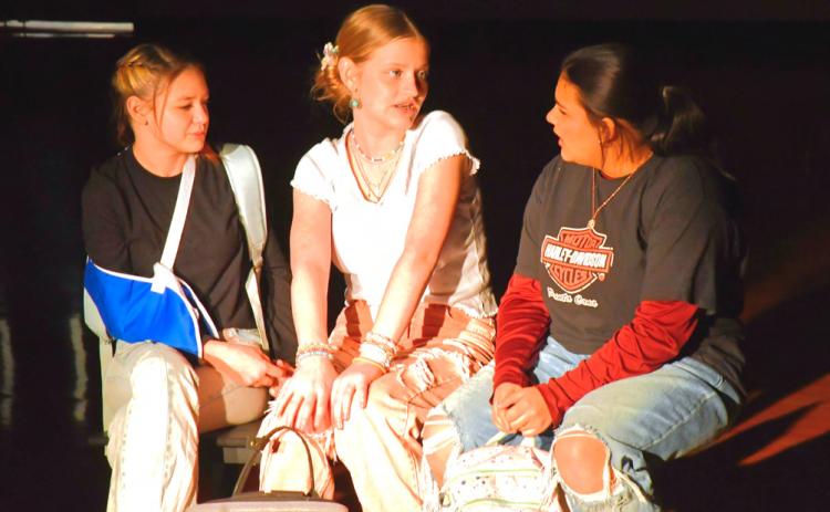 Taylee Cyrus, left, and Kloey Garrett, middle, play the parts of characters welcoming welcoming the new girl,played by Ava Huggett, right, in Webster Area School’s one act play Bus Stop Jan. 25. In the show, Huggett’s character just started at this school due to issues at home and is fighting mental battles. Cyrus’ and Garrett’s characters have to decide if their duo of fun can include another. Reporter &amp; Farmer | Connor Handrahan