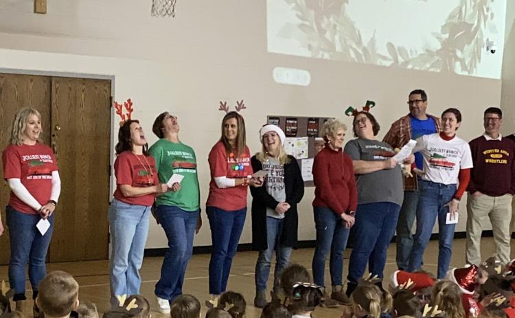 Webster Area Elementary School staff and students took part in a Christmas sing along in the elementary school gym Dec. 20. Staff, from left, leading the singing of The 12 Days of Christmas are Vanessa Bloom, Robin Dorsett, Jennifer Witt, Ashley Hanson, Christine Keller, Nancy Block, Heather Kwasniewski, Jared Vergeldt, Emily Wagner and Wade Rausch.