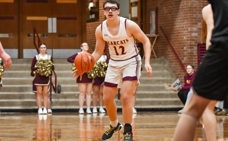Jeron McCreary (12) of Webster Area looks for an opening during the Bearcats 73-53 win over Waverly-South Shore Coyotes Jan. 27 in Webster. McCreary aided in the victory with a nine point performance. Reporter &amp; Farmer | Leyton Beardslee