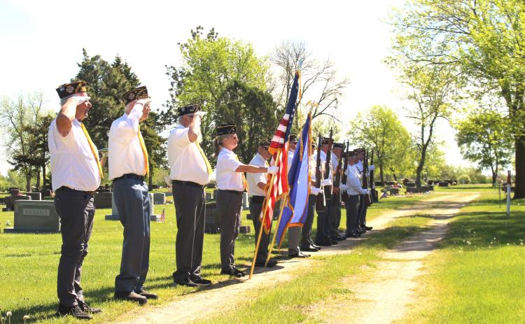 Veterans of Foreign Wars Post 4690 and American Legion Post 40 Honor Guard led by Commander Mike Wiley performs a ceremonial volley and taps at Soldier’s Circle, Saint Otto’s Cemetery, Webster, to honor our troops who made the ultimate sacrifice. Pictured from left are Robert Duerre, Floyd Hansmeier, Doug Lynch, Brenda Larson, Randy Gaikowski, Josh Anderson, Doug Van Houdt, Garry Fossum, Ed Damrau, Mike Wiley, Dennis Kurkowski and Tom Lewno. Reporter &amp; Farmer | Timothy Gibson