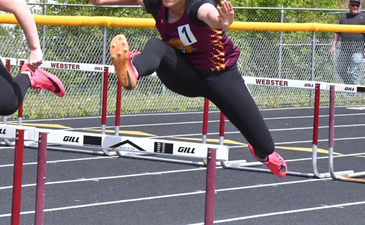 Emily Acree races in the 100m hurdles at the Webster Invitational May 21. Acree placed third with a time of 19.55. Reporter &amp; Farmer | Connor Handrahan