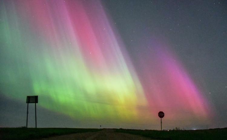 This image of the aurora borealis, usually seen to the north, was taken facing due west on a rural county road south of Webster in the early morning hours of May 11. This particular show of lights was caused by a solar storm flare that hit earth, one of the largest in nearly 20 years with a KP level of 8+. While the camera lens exaggerates the color profile of the lights, some of the colors could be seen with the naked eye. Reporter &amp; Farmer | Amanda Dulitz