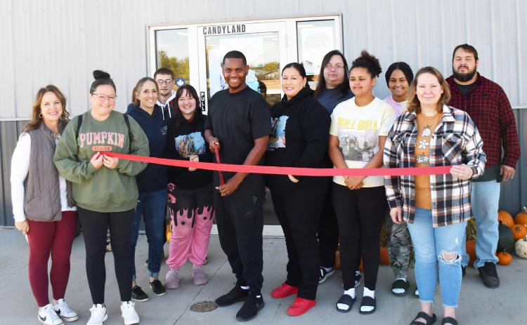 Candyland Smoke Shop officially cut the ribbon for their business Oct. 4. Present at the ribbon cutting were Candyland staff and members from Webster Area Chamber of Commerce. Pictured from left, Kathy Kwasniewski, Tammy Eidahl, Jami Hubsch, Kaylob Alston, Megan Traylor, Jessie Scott Sr., Bridgette Neilan, Roberta Neilan, Kailesha Neilan, Casharie Neilan, Julie Spiering and Curtis Neilan.
