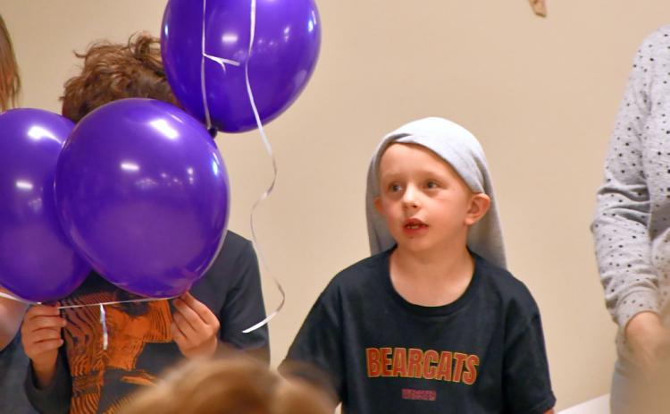 Kohenn Konradi recites the Rosary as part of a balloon Rosary ceremony at Christ the King Parish Center in Webster April 30. Reporter &amp; Farmer | Leyton Beardslee