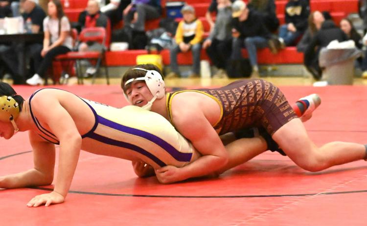 Nathan Hubsch of Webster Area Bearcats attempts to pin his opponent during their match in the Battler Wrestling Invitational Jan. 17 in Gettysburg. Hubsch placed fifth with a record of 4-2 and scored 17 team points. Reporter &amp; Farmer | Brianna Jorgenson, Captured Creations Photography