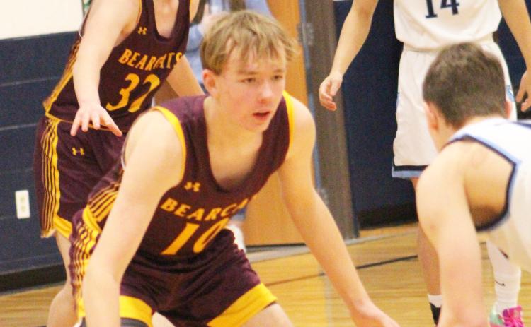 Bearcats traveled to face Leola/Frederick Area Titans Feb. 15 which ended in a 42-70 Webster Area loss. Here, Sheldon Schmieg (10) watches a Titan player closely while his teammate Gage Wik (32) guards Lucas Gulbranson (14) near the paint. Reporter &amp; Farmer | Subscriber Snapshot