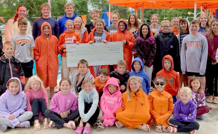 Swimmers accept donation