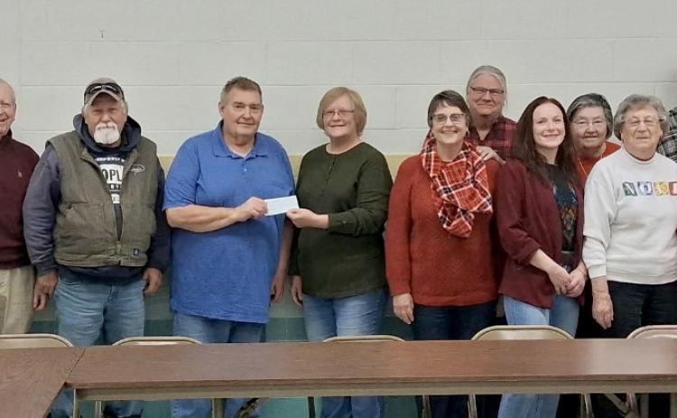 Day County Democrats donated $375.00 to Day County Food Pantry. Present were, from left, Gary Monson, David Sigdestad, Gene Gaikowski, Bob Bullert, food pantry director Margaret Kwasniewski, Becky Heimerl, Kim Heimerl, Courtney Enfield, Linda Roth, Alice Bartell, Carl Pulvermacher, Carol Richardt and Loren Johnson. Reporter &amp; Farmer | Subscriber snapshot