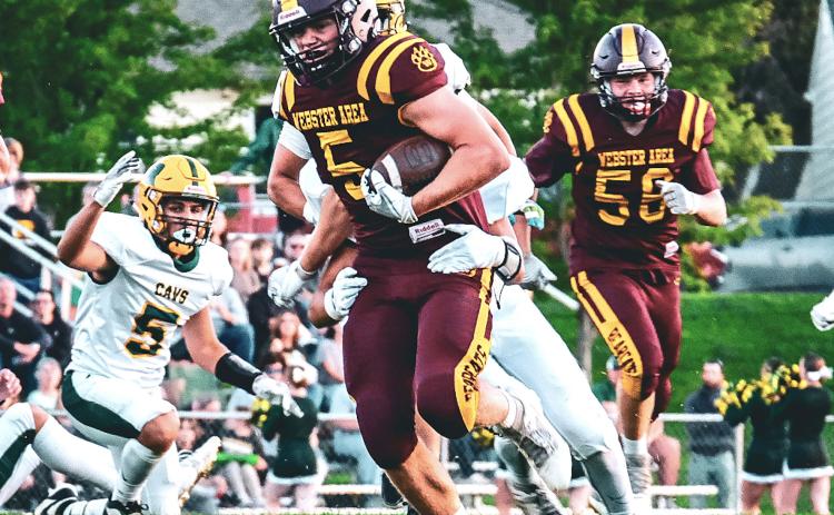 Webster Area running back Gage Baumgarn shrugs off a tackle during the Bearcat’s 32-26 win over Aberdeen Roncalli Sept. 26 in Webster. Baumgarn finished with 31 carries for 203 yards and two touchdowns. Reporter &amp; Farmer | Leyton Beardslee