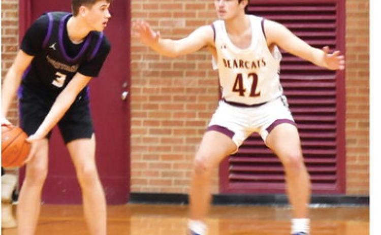Waubay-Summit Mustangs faced off against the Webster Area Bearcats Dec. 17. Mustangs won the game 45-44. Here, Waubay-Summit guard/forward Hogan Hlavacek (3) assesses the Webster Area defense as Webster Area forward Jack Shoemaker (42) keeps applying pressure. Reporter &amp; Farmer | Brenner Cariveau