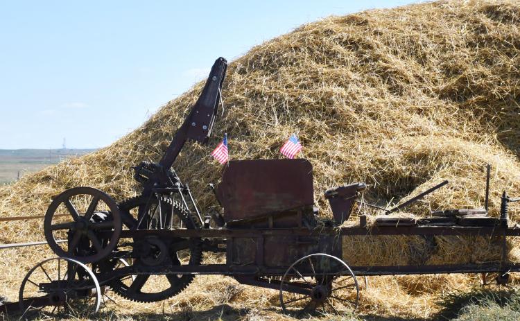 Agricultural practices were demonstrated in Andover with the semicentennial celebration of the James Valley Threshing Show taking place Sept. 6-8. Pictured here, is a vintage method of baling hay which was displayed for guests. Reporter &amp; Farmer | Brenner Cariveau