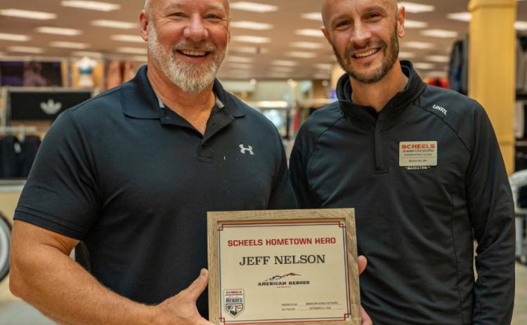 Day County Veterans Service Officer Jeff Nelson, left, was recognized by Scheels as a Hometown Hero Sept. 22 in Sioux Falls. After serving nearly 36 years in the U.S. military, Nelson is now dedicated to serving his fellow veterans. Josiah Christoffer, Scheels Assistant Store Manager, is pictured right. Reporter &amp; Farmer | Subscriber Snapshot
