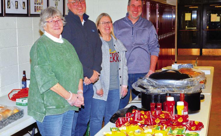 Roslyn Booster Club provided sandwiches, chips and cookies to the community for their appreciation day and Santa meet and greet Dec. 5. From left, Mary Wagner, Ryan Wagner, Shelly Deutsch and Josh Wagner greeted and served guests as they entered the community center. Reporter &amp; Farmer | Connor Handrahan