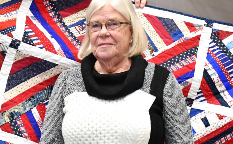 Reporter &amp; Farmer | Leyton Beardslee Winnie Jacobs receives a Quilt of Valor for her late husband William Jacobs during the annual veterans banquet at Webster Armory Nov. 8. William Jacobs served as a Petty Officer in the United States Navy from 197074 and his awards include Combat Action Ribbon, Vietnam Campaign Medal, and the Vietnam Service Medal with Bronze Star.
