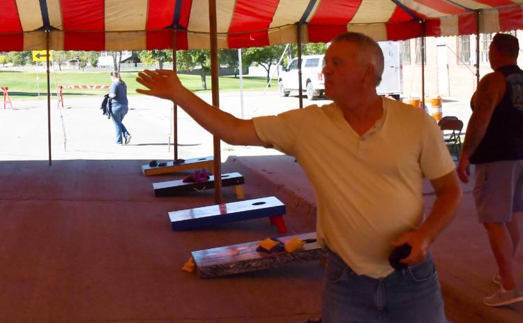 The annual Germanfest was celebrated Sept. 28. One of the many activities during the day was a cornhole tournament which cost $40 per team to register. Here, Rick Guse from Bartonville attempts a tune up shot prior to the tournament’s starting time. Reporter &amp; Farmer | Brenner Cariveau