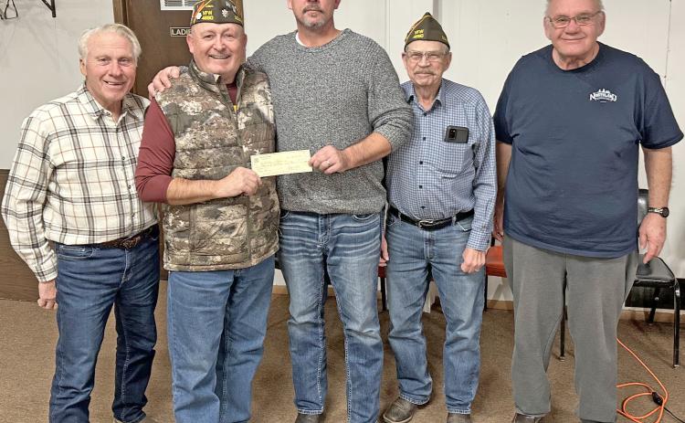 Members of VFW Post 4690 in Webster made a donation to Webster Theatre in order to bring the showing of a free kids movie for area children. The check donation, in the amount of $1,000, was presented Dec. 10. Pictured from left are VFW member Dennis Kurkowski, VFW Commander Kevin Bohn, Webster Theatre owner Shawn Rithmiller, VFW members Wayne Anderson and Tom Lewno. Reporter &amp; Farmer | Subscriber snapshot