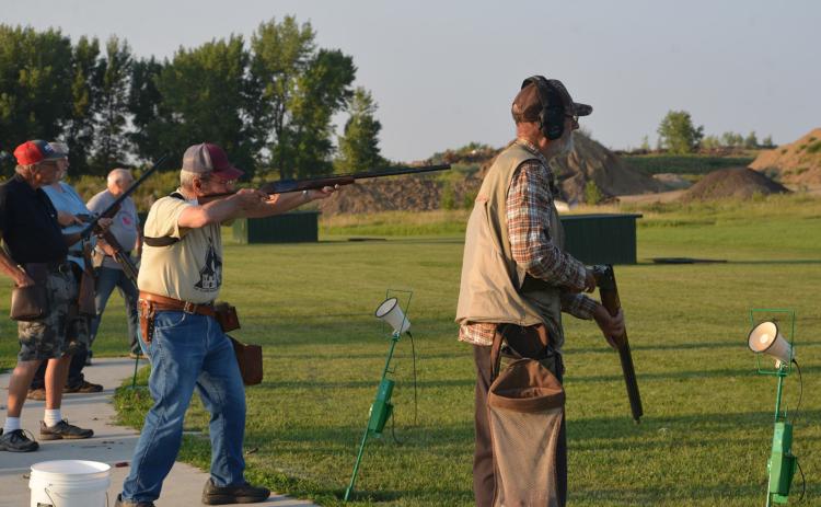 Rick Hanson takes aim at a target Aug. 25 at Webster Claybird Club. Trap shooters line up in groups of five, taking five shots from each position – 25 shots in total. From left to right: Doug Herold, Rich Proctor, Donnie Bloom, Roland Hanson and Paul Dulitz. Reporter &amp; Farmer | Timothy Gibson