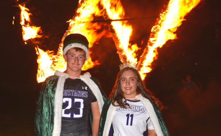 Waubay Homecoming King Witten Butler, left, and Queen Bailey Utne, right, at the homecoming ceremony Sept. 28, just moments after lighting the W. Reporter &amp; Farmer | Timothy Gibson