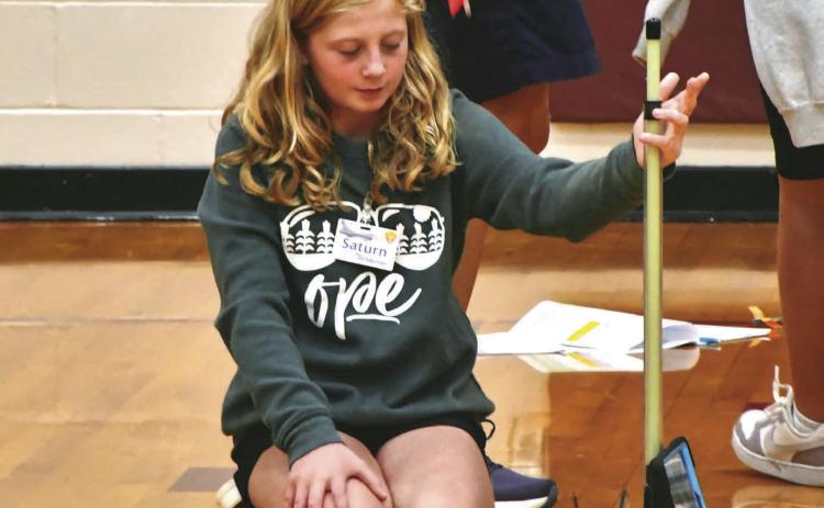 Reporter &amp; Farmer | Leyton Beardslee Webster Area fifth grader Tenlee Wik, daughter of Matt and Jenna Wik, launches an air pressure powered rocket made from a straw Sept. 9. in the Webster Area High School gym. The experiment was part of the weeklong STARBASE program hosted by the school which teaches students about STEM concepts.