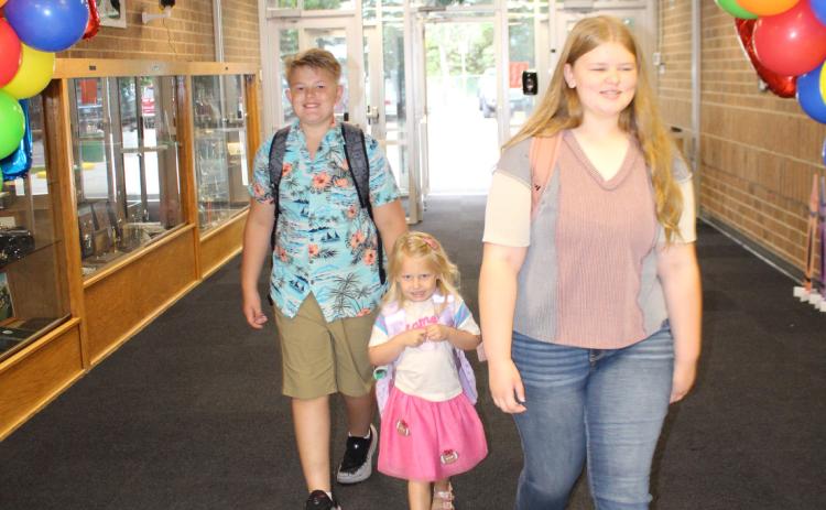 Students walk through the entrance hall of Waubay School, returning from summer break for the first day of class Aug. 19. From left are Jayce Johnson, Hope Johnson and Faith Gaikowski. Reporter &amp; Farmer | Timothy Gibson
