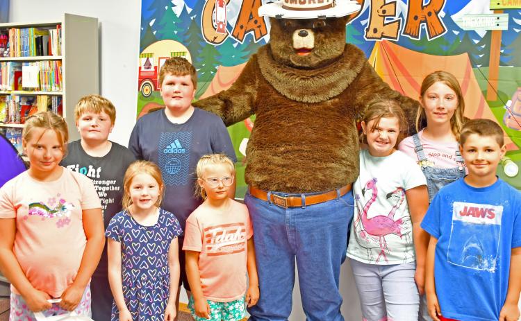 Webster Area Public Library celebrated the 80th birthday of Smokey the Bear July 12. Since 1944 Smokey the Bear has been the symbol of protection for America’s forests and grasslands from human-caused wildfires. Pictured are those who helped celebrate the occasion, from left front Freyja Howe, Addy Johnson, Beatrix Howe, Gracelyn and Archer Chevalier. Back row includes Corbin and Bryson Johnson and Iris Marsh. Reporter &amp; Farmer | Annie Witt