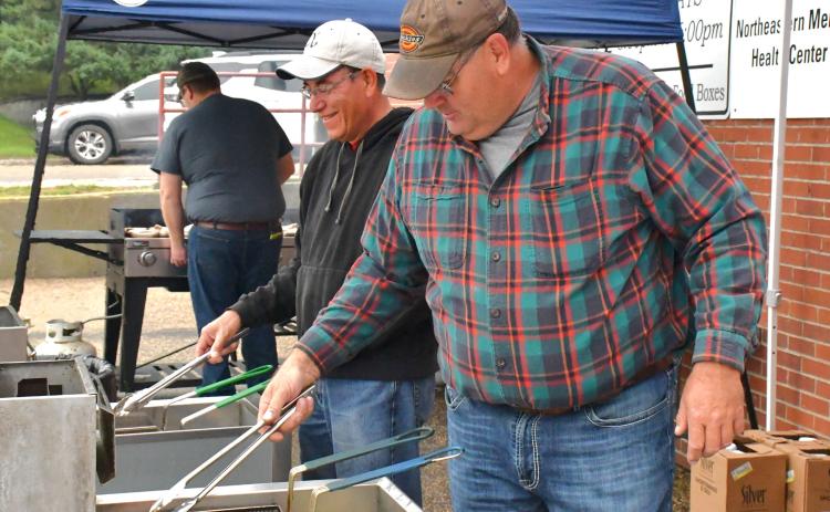 A German dinner was provided for attending community members at the annual German Fest Sept. 26. From left, Alfredo Garduno and Nathan Fischer help fry the schnitzel for the meal. Reporter &amp; Farmer | Connor Handrahan